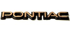 1987-1992 GTA TTA Turbo Trans Am Driver Side PONTIAC Headlight Emblem *10053028 picture